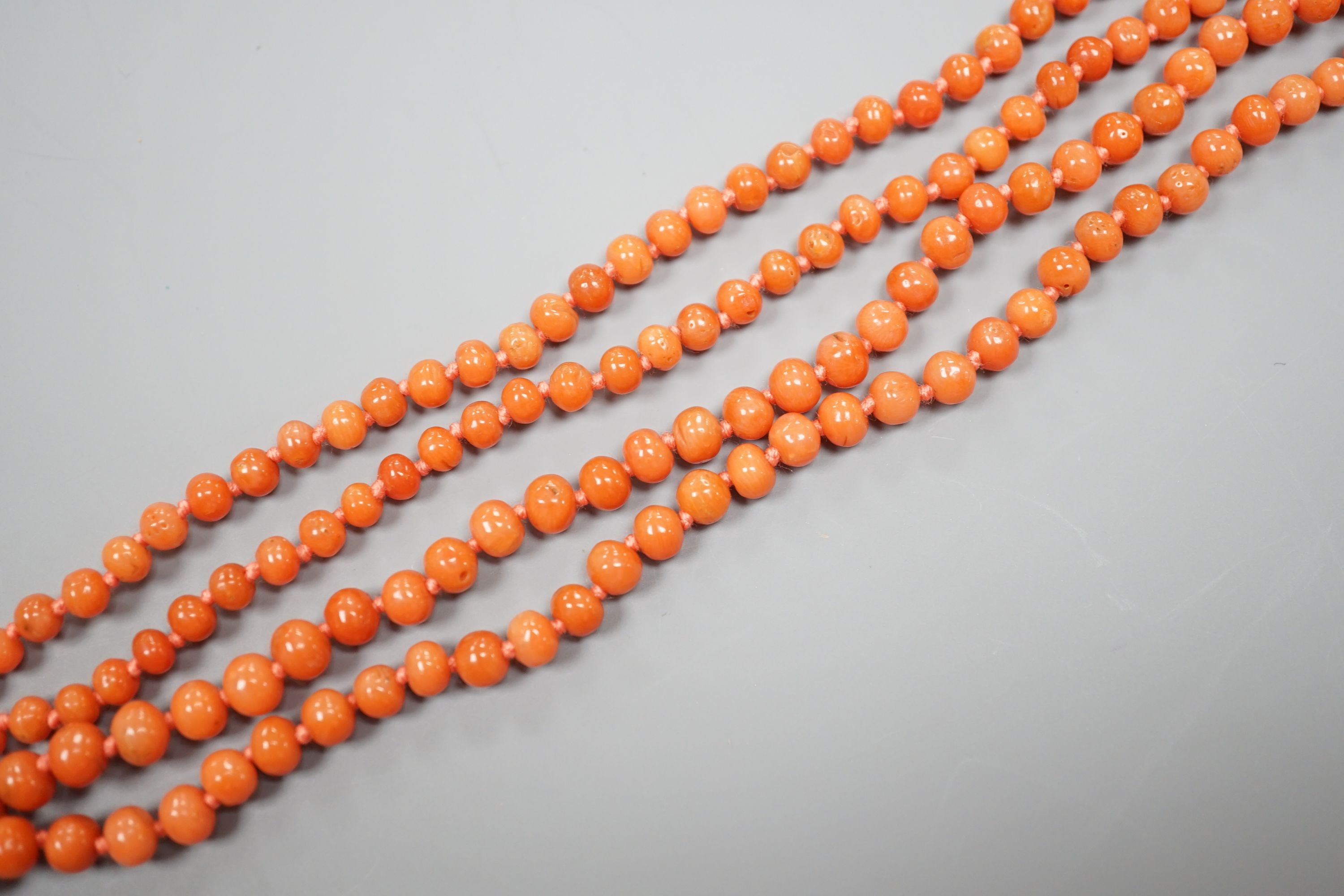 A single strand graduated coral bead necklace, 154cm, gross weight 48 grams.